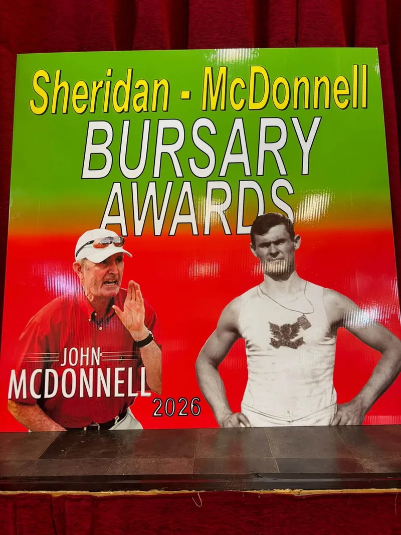 The 2026 Sheridan-McDonnell Bursary Awards sign on the Main Hall stage