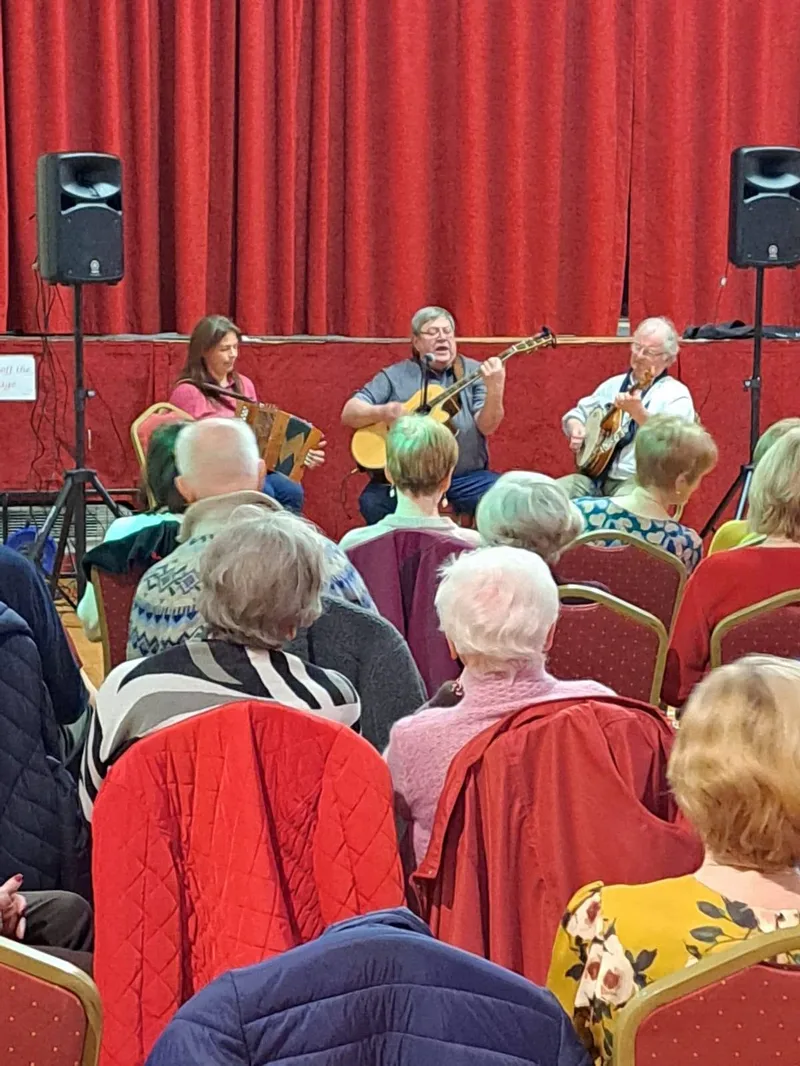 Traditional musicians playing on the Main Hall stage in front of the audience