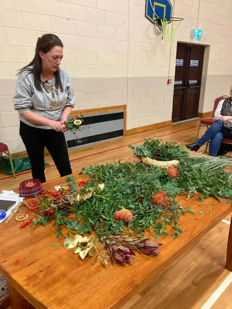 Eilish Egan of Blossoms.ie preparing greenery for a Christmas wreath in the Main Hall