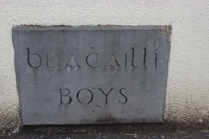 Carved stone over the old boys' entrance, reading Buachaillí and Boys